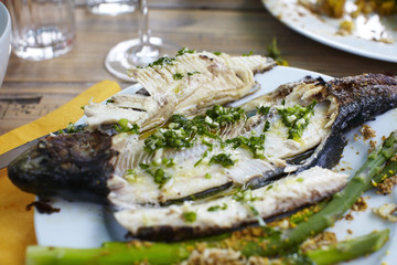 Grilled trout with garlic and parsley sauce