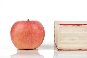 Red apple with dictionary