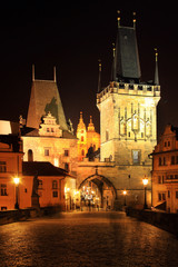 Fototapeta premium Night Prague St. Nicholas' Cathedral and the Bridge Tower