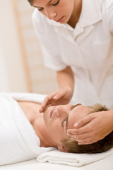 Fototapeta na wymiar Male cosmetics - facial massage in salon