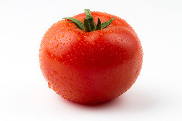 Fresh red tomato on white