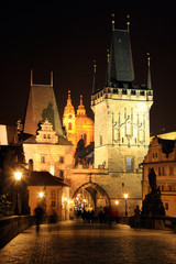 Fototapeta na wymiar Night Prague St. Nicholas' Cathedral and the Bridge Tower