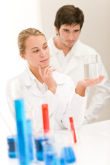 Scientists in laboratory test chemicals