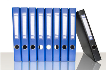 blue ring binders in row and reflection