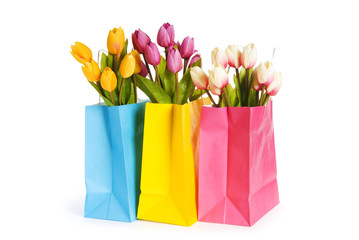 Tulips in shopping bag isolated on white