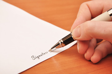 pen signing a contract