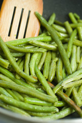 Fried green beans and wood utensils