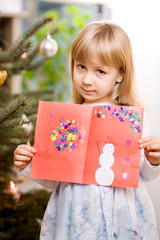 girl with christmas card - obrazy, fototapety, plakaty