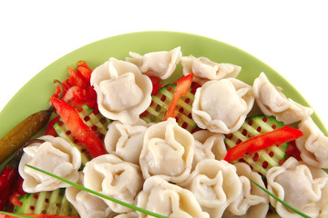 dumplings served with vegetables on green