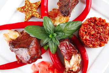 roast meat chunks on white plate