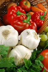 Composition with basket and vegetables on kitchen table