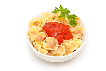 cappelletti with tomato sauce on white background