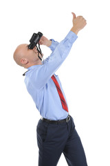 Businessman looking through binoculars