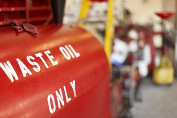 Waste oil container in a mechanic's garage.