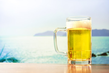 refreshing beer mug on the beach
