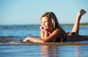 Happy girl relaxing in the water