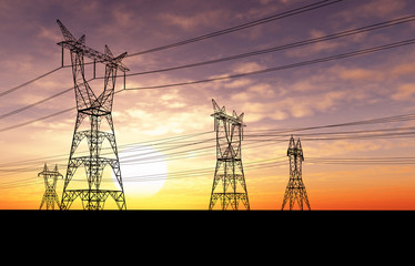 Electricity pylons and lines at dusk.