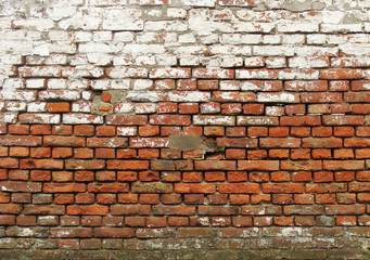 see through worn brick wall with white paint