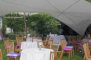 Wicker table setting at the outdoor marriage ceremony