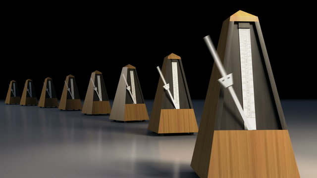 A line of ticking metronomes.