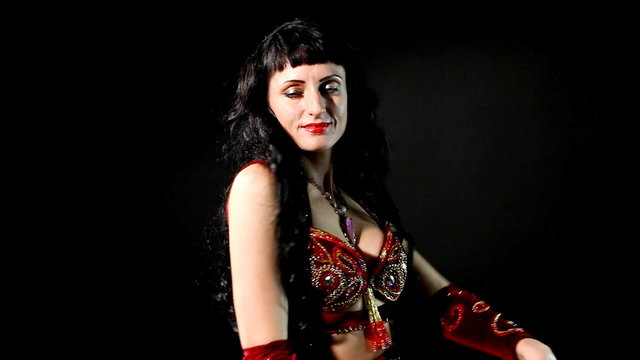woman Belly dance in red- look and smile
