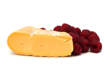 raspberry and french cheese on white, shallow dof