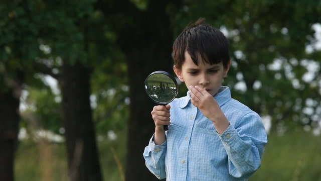 The boy with a magnifier