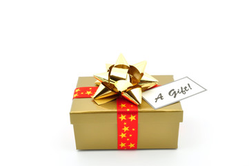 gold box with gold bow red ribbon and