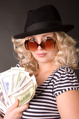 Obraz premium portrait of beautiful woman of blonde is in a hat and glasses