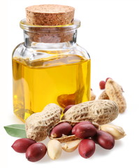 bottle of peanut oil with nuts