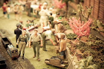 miniature garden full of people and objects