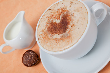 Cup  tasty cappuccino coffee with froth