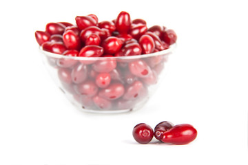 glass bowl with ripe Cornelian cherries