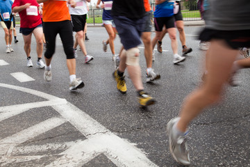 People running in city marathon