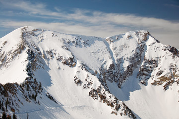 Fototapeta na wymiar Beautiful Mountain with Ski Run Cutting Across