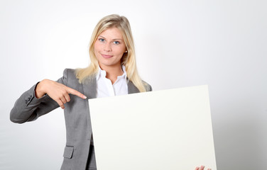Businesswoman holding white panel