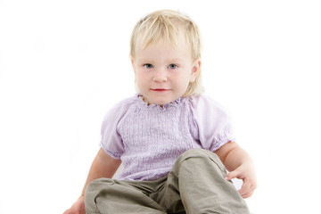 studio portrait of cute toddler girl over white