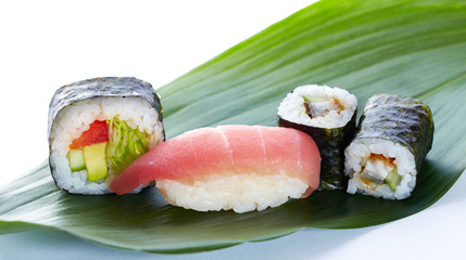 Asian maki on green leaf