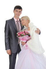 groom gives the bride a bouquet of roses