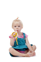 little girl eating banana © courtyardpix