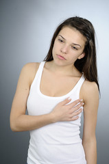 white woman examining her breast