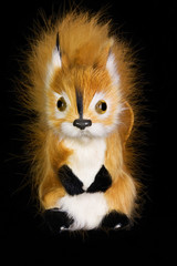 Figurine squirrel macro isolated on black