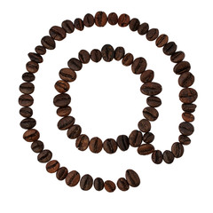 coffee beans lying in the shape of at sign