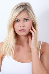 Obraz premium Beautiful blond woman on white background