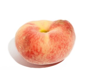One peach isolated with shadoiws