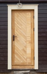 New wooden doors with wall.