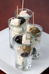 Greek appetizers with black and green olives and feta cheese