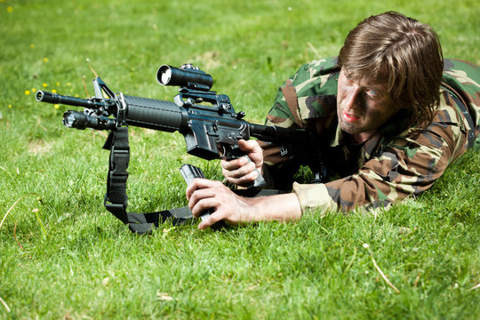 soldier in the field reloading the gun