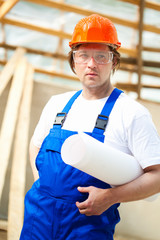 builder holding construction plan