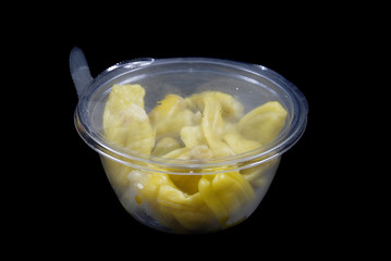 instant food plastic sealed bowl of yellow peppers